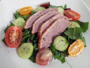 Smoked Duck Breast over Dandelion Greens